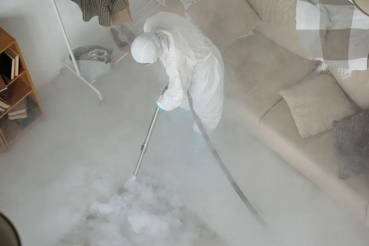 Biohazard cleanup technician in protective equipment, Lyons, OR
